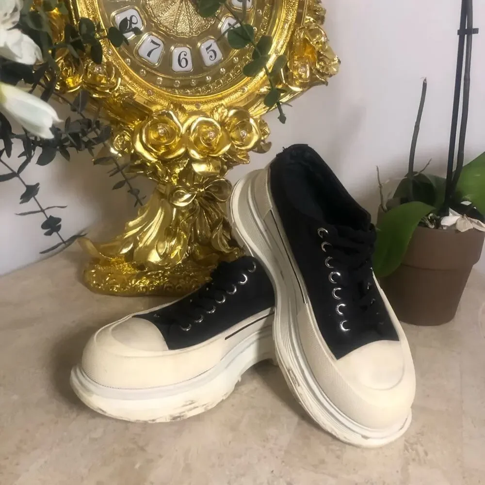 Alexander McQueen black and white platform chucks.
